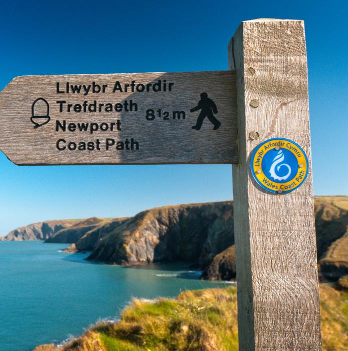 Wales Coast Path and Pembrokeshire Coast Path sign.