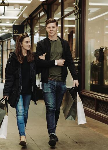 Couple shopping in Morgan Arcade, Cardiff.