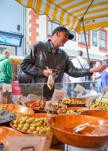 Man buying food from stall at festival