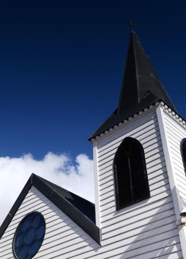 Close up image of the roof and steeple of the Norwegian Church
