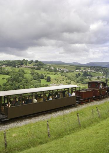 Brecon Mountain Railway steam train travelling through the Brecon Beacons.
