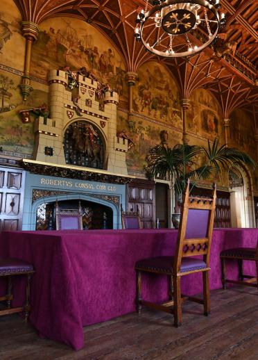 Medieval dining table in the ornately decorated banqueting hall at Cardiff Castle.