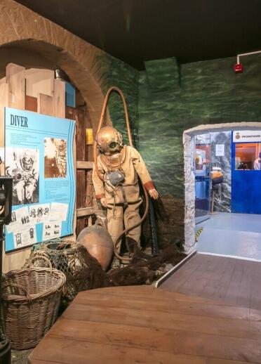 museum displays including an old fashioned diving suit