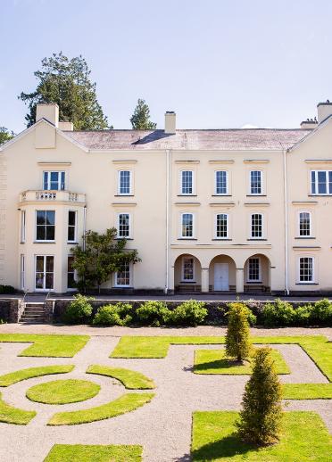 The exterior of Aberglasney House in Llangathen with garden in foreground