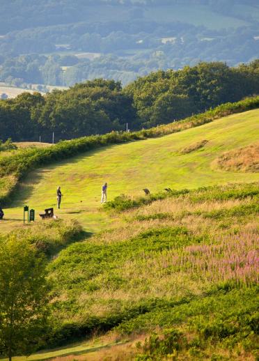 Golfers playing a round with stunning views seen from the height of Llandrindod Wells Golf Club.