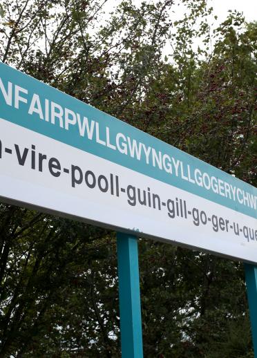 Llanfair PG sign at railway station, with name in full.