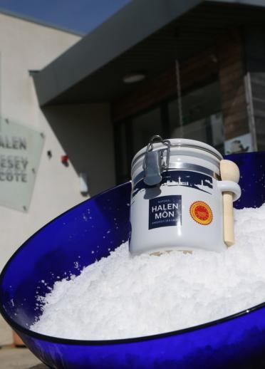 Bowl of Halen Mon salt with white salt jar, outside the distillery entrance.