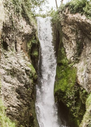 A waterfall falling down a gorge.