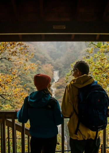 Couple looking out at a waterfall 