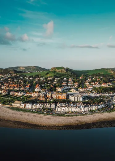 aerial view of Deganwy Castle remains from above Conwy estuary.