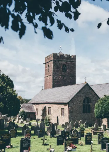 An old stone-built church with a tower.
