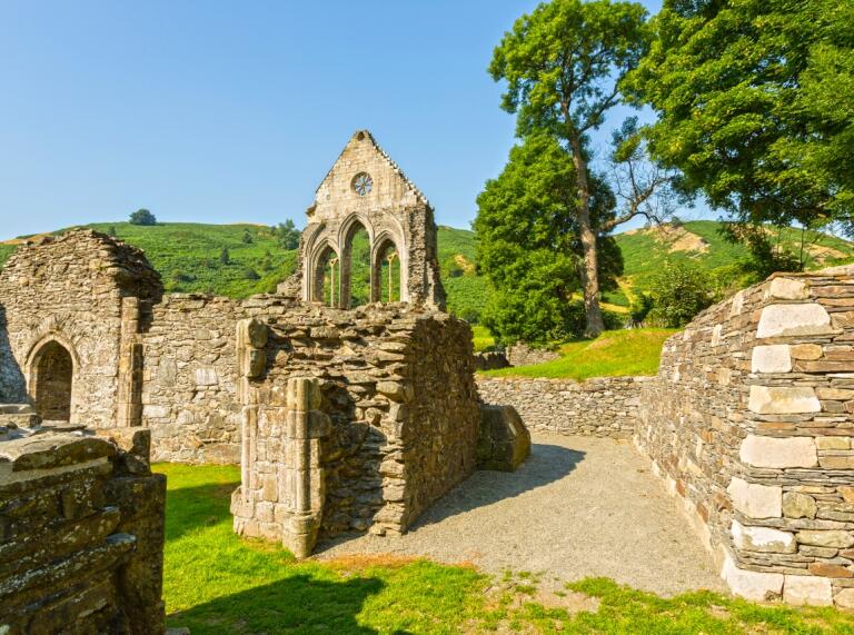 The ruins of an old abbey on a sunny day.
