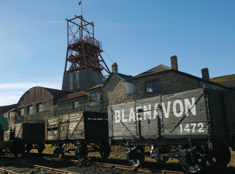 Wagons and the pit head tower at Big Pit.