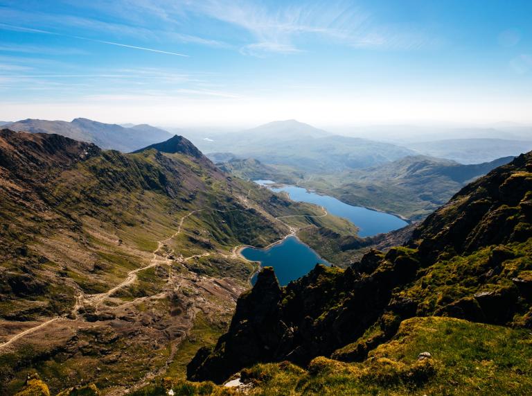 Photo taken on a bright day with views from Snowdon of mountains and lakes.