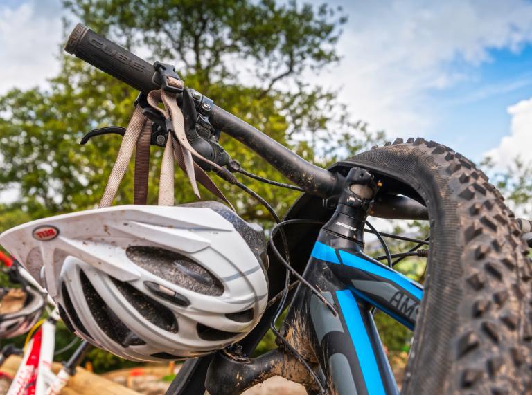 Mountain Bike close up with helmet hanging from handlebars at Bike Park Wales