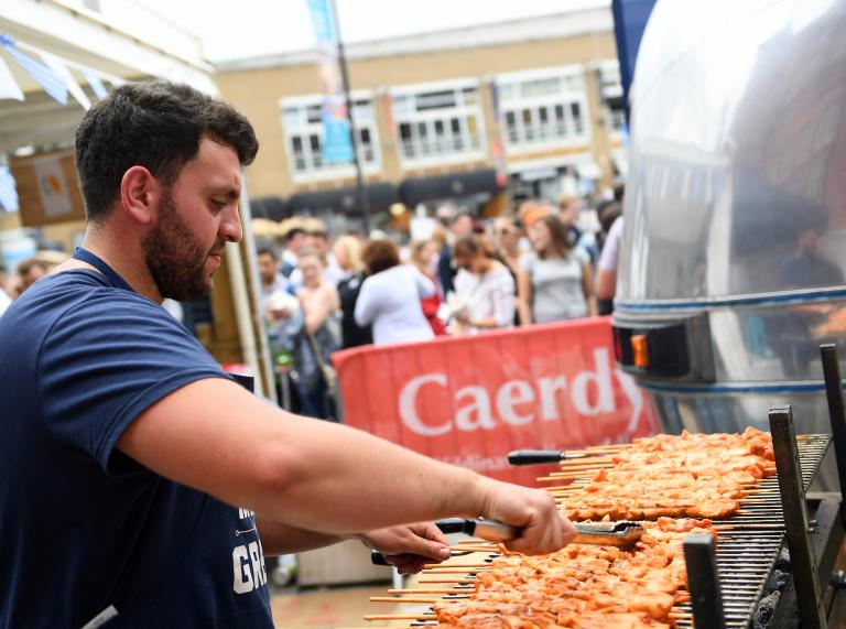 Live cooking at a food stall at Cardiff International Food Festival 