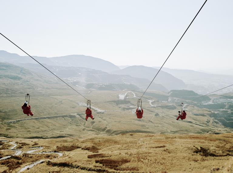 Four people on a zipwire.