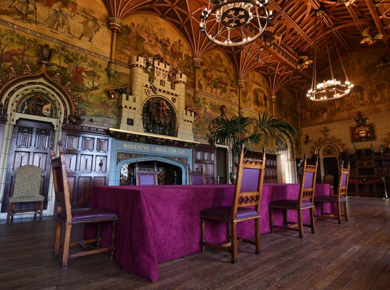 Medieval dining table in the ornately decorated banqueting hall at Cardiff Castle.