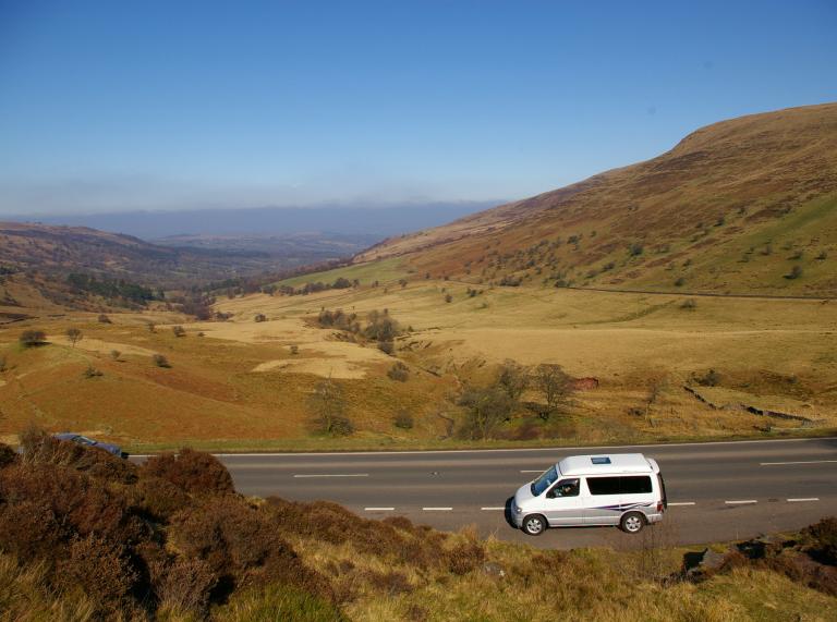 looking down at campervan parked on the A470 with hill in background