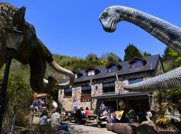 Dinosaur and a woolly mammoth by the cafe at Dan yr Ogof caves.