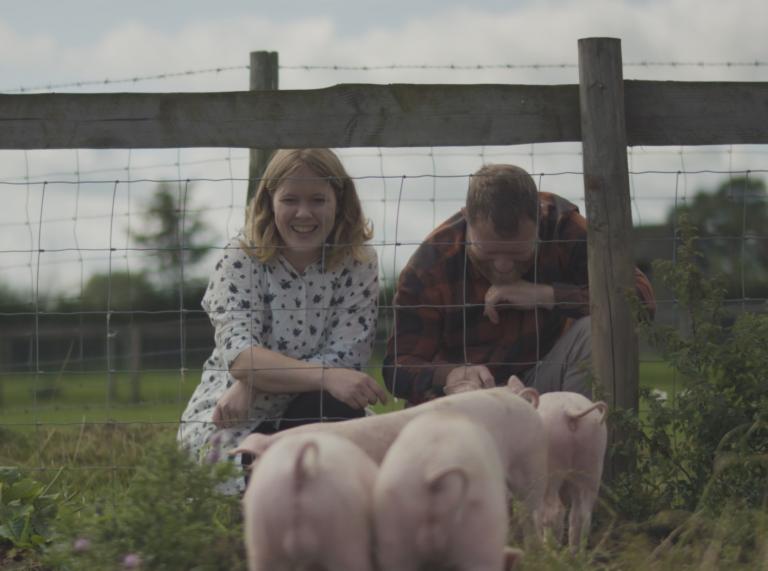 Nina and Joe Howden with piglets at Humble By Nature farm in Penallt, the Wye Valley.