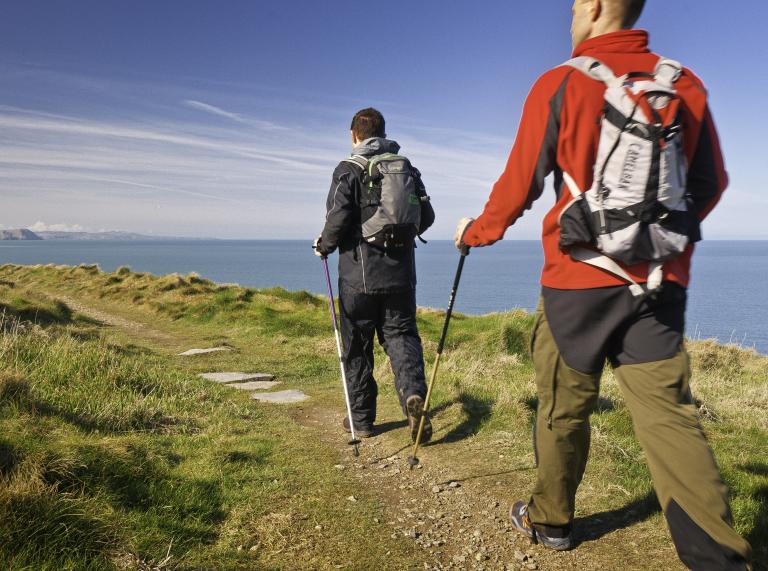 Two male walkers on coastal path at Ceibwr.