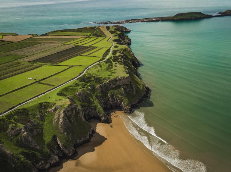 Aerial view of Rhossili beach and Worm's Head.