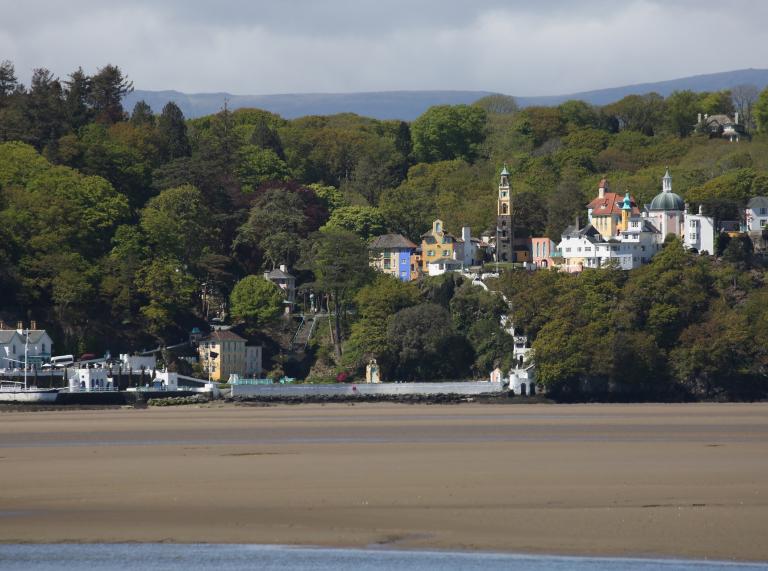 Portmeirion hidden in the trees, view from over the river