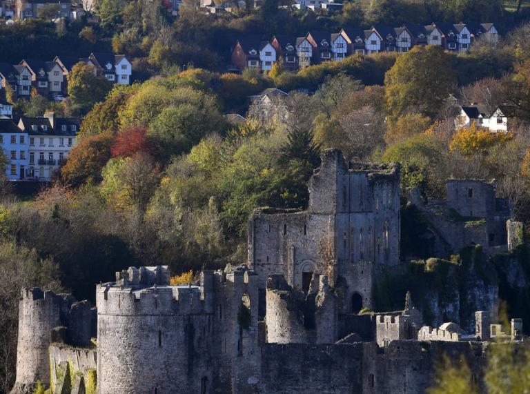 A view of Chepstow showing the castle and houses of the town.