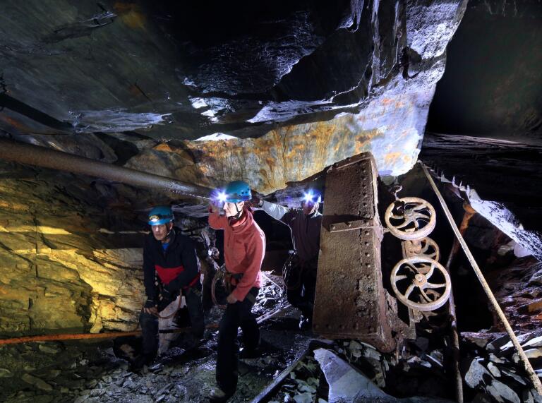 Teams make their way through the runaway truck cavern at Go Below Xtreme experience, Cwmorthin Mine, Tanygrisiau.