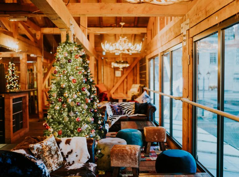 wooden ski lodge with Christmas tree.