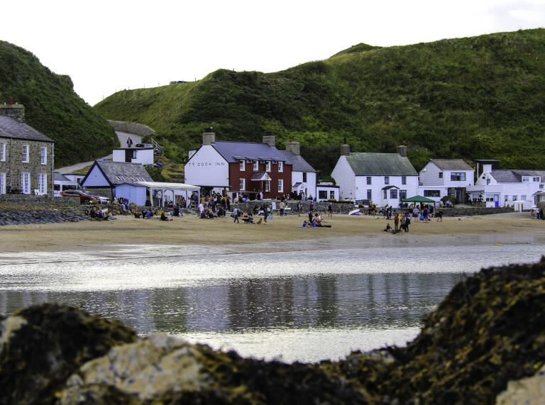 A row of houses on a beach edge.