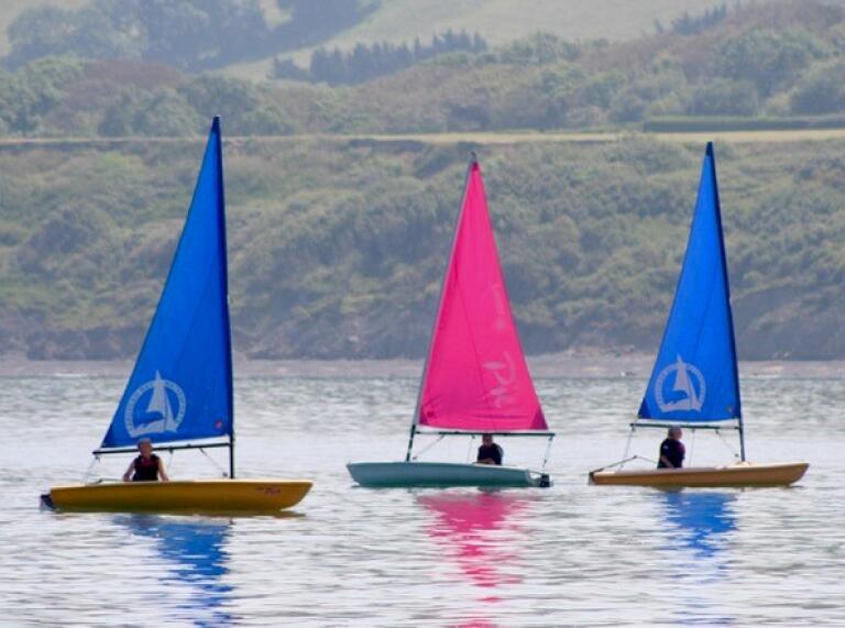 three sailing boats.