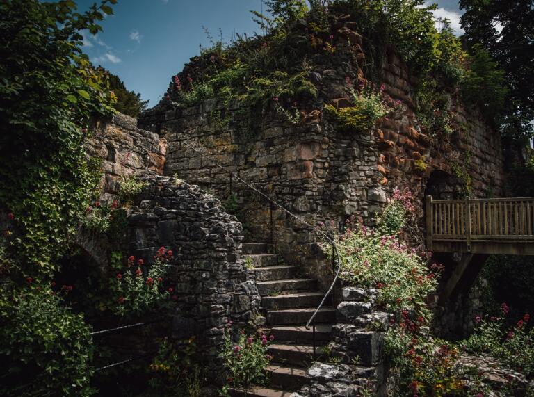 An outside stone staircase in a castle.