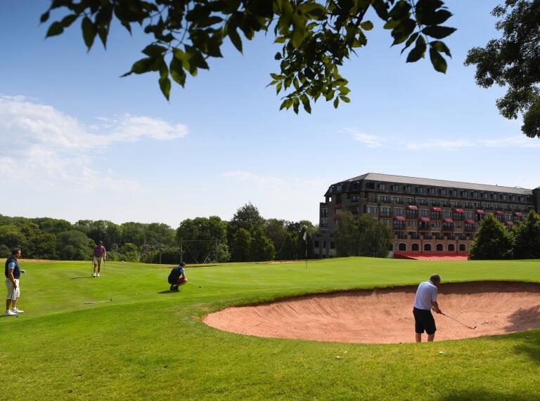 People playing golf at the Celtic Manor Resort.