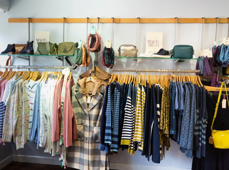 rail of clothes and accessories.