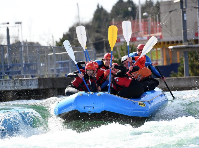 Group of people on a whitewater raft.