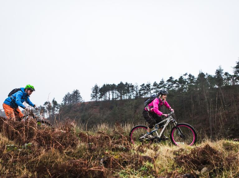 two mountain bikers on a trail at Afan Forest Park.