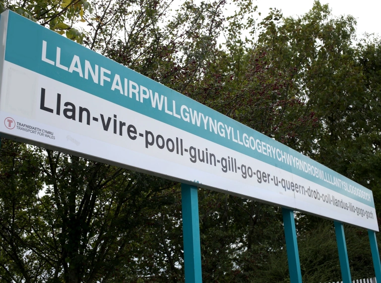 Llanfair PG sign at railway station, with name in full.
