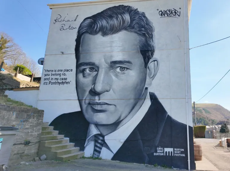 building with a giant mural of actor Richard Burton.