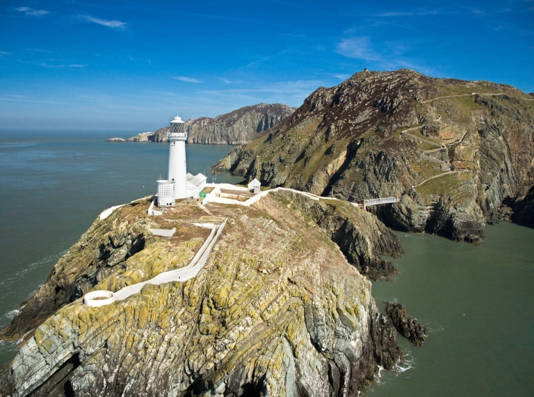 Image of South Stack Lighthouse from above, perched on a clifftop.