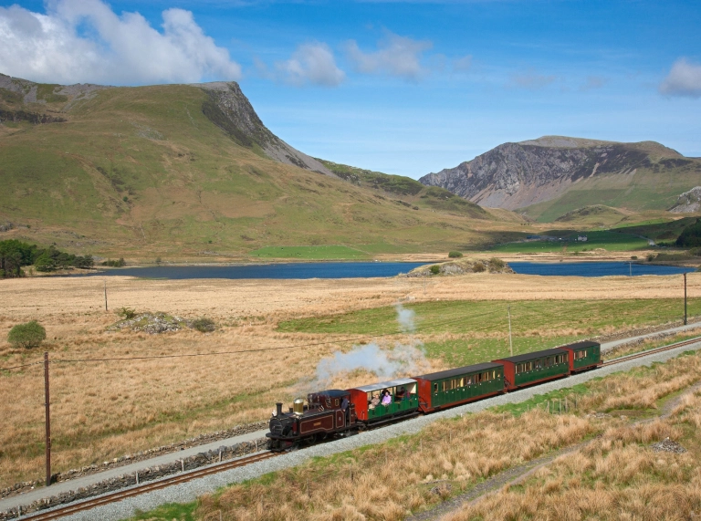 Narrow Gauge train passing Llyn y Gader near Rhyd Ddu.