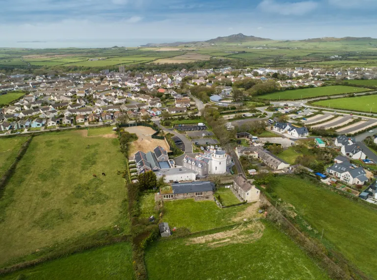 Aerial view over a small rural city looking towards coast. 