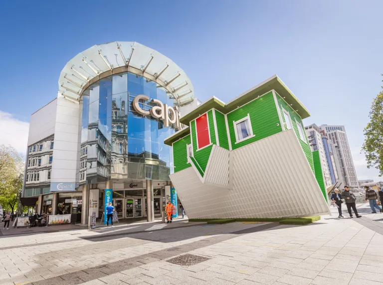 The exterior of St David’s shopping centre in Cardiff city centre, with the a sculpture in the foreground.