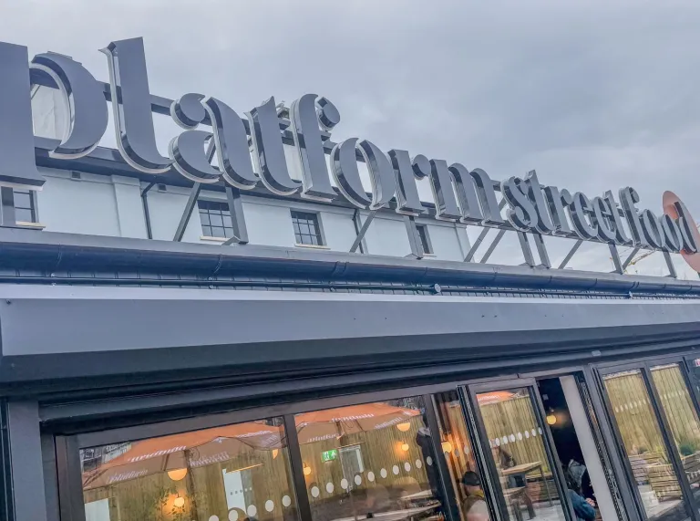 Exterior of Platform Street Food restaurant with large rooftop signage above the entrance.