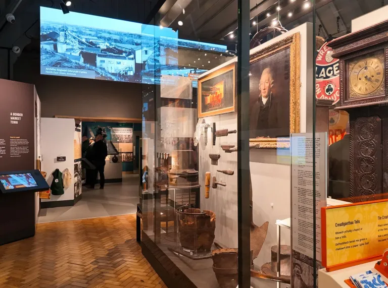 Wrexham Museum gallery featuring historic artefacts, photographs and interactive displays exploring the city’s history.