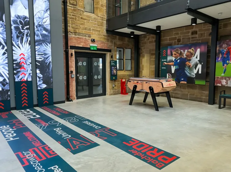 Football Museum of Wales gallery with a table football game, large football displays and graphics celebrating the people and history of Welsh football.