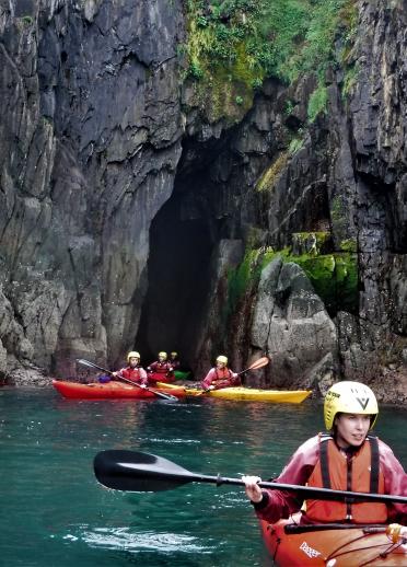 Group in kayaks in caves.