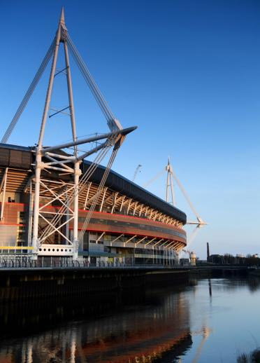 A side view of Principality Stadium sitting alongside the river.