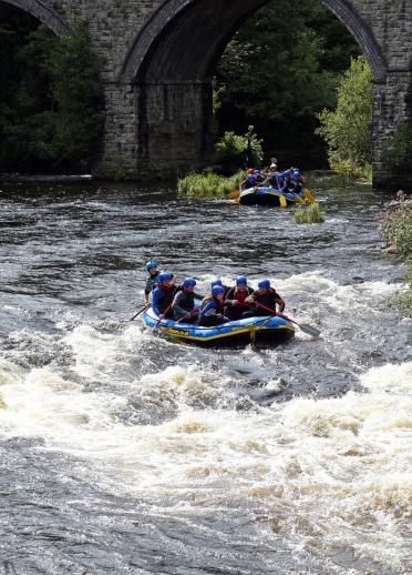 white water rafts on river.
